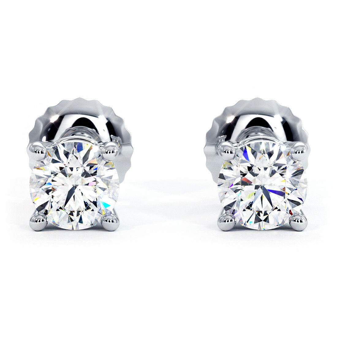 A stunning pair of PREMIUM SIGNATURE QUALITY diamond solitaire stud earrings weighing 1 1/2 carat total weight. The diamonds are set on 14K white gold basket settings with screw back posts