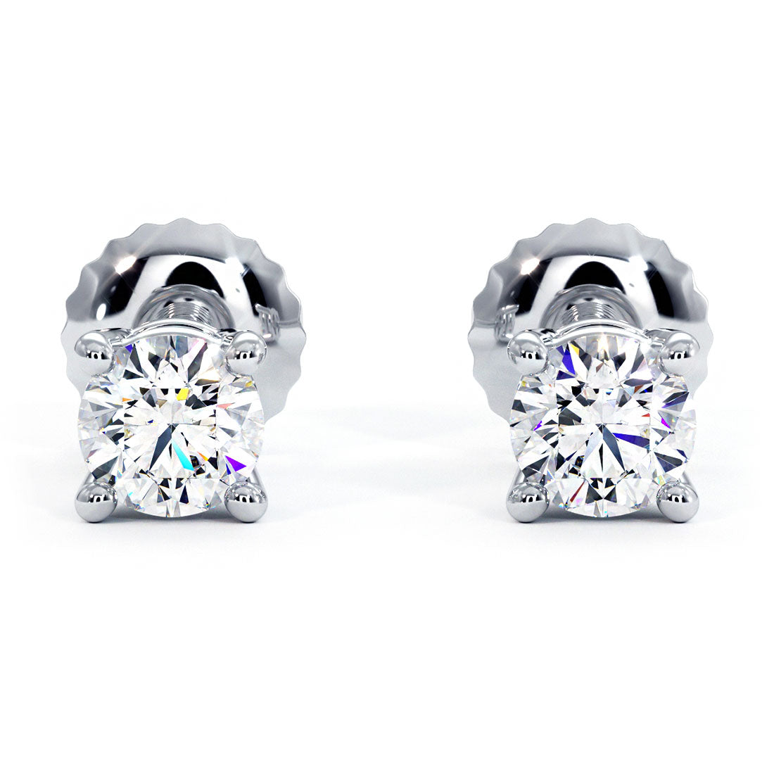 A stunning pair of PREMIUM SIGNATURE QUALITY diamond solitaire stud earrings weighing 1  carat total weight. The diamonds are set on 14K white gold basket settings with screw back posts