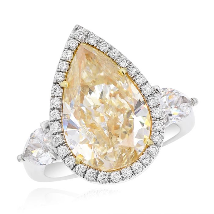 Monary Ring featuring 0.32 carats of diamonds, 0.86 carats of pear diamonds, 6.31 carats of fancy yellow pear diamond set in platinum