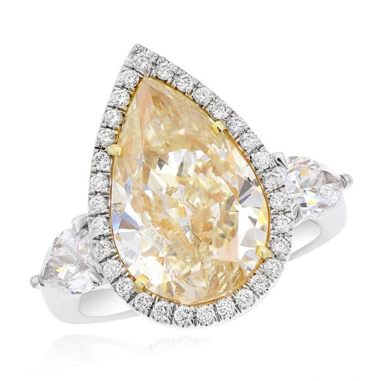 Monary Ring featuring 0.32 carats of diamonds, 0.86 carats of pear diamonds, 6.31 carats of fancy yellow pear diamond set in platinum